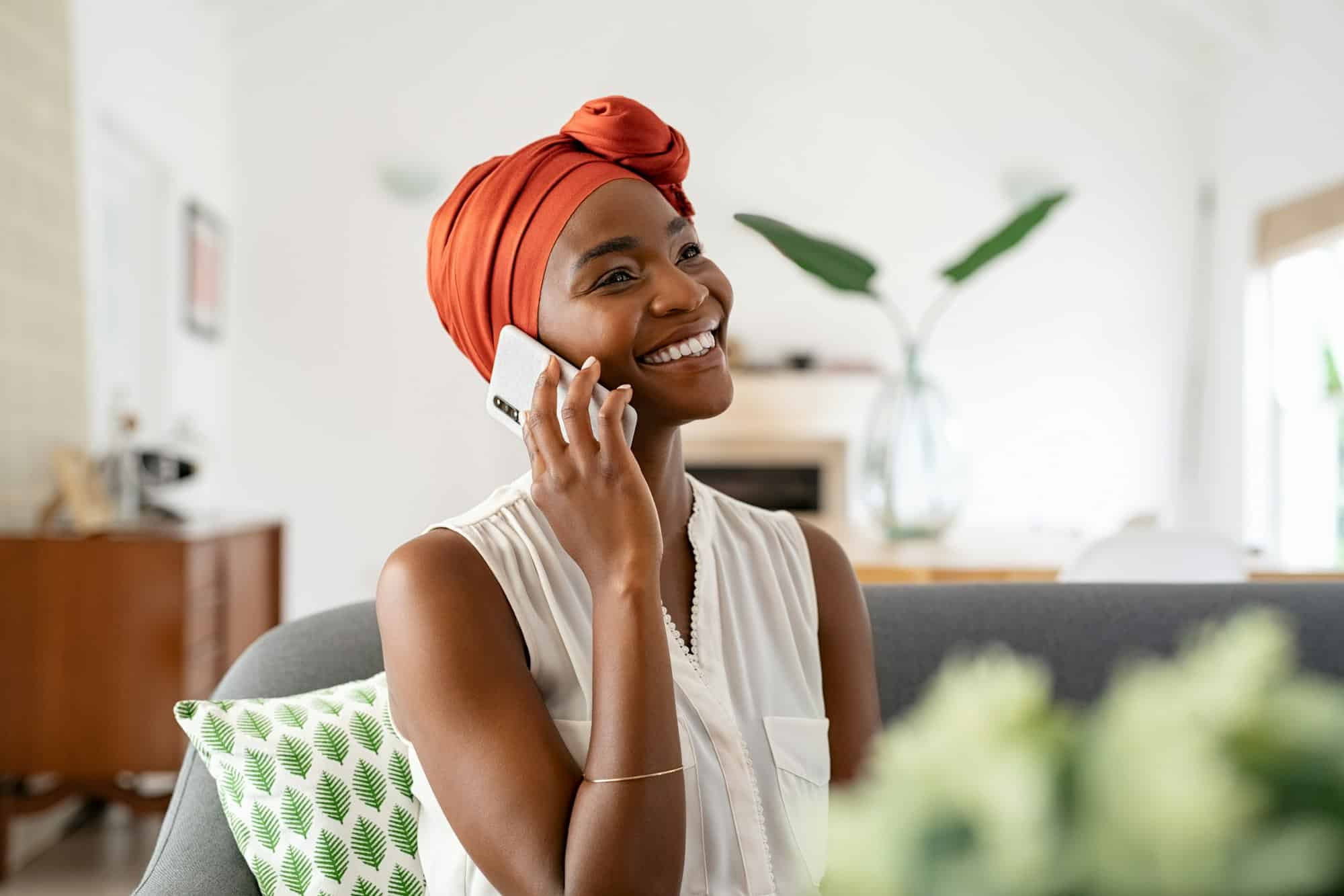 Mature african woman talking over phone