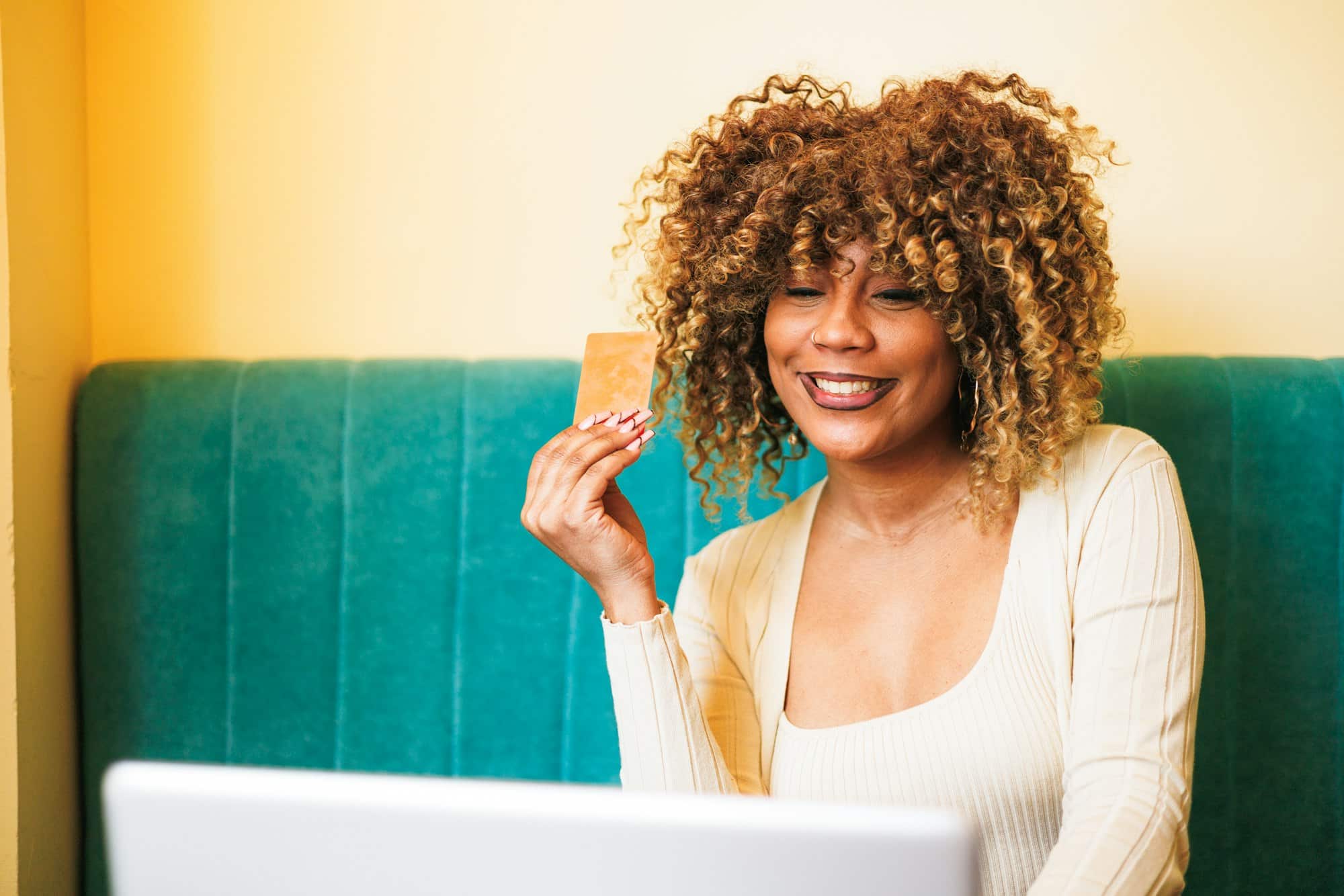 Dominican Woman in Cafe: Enjoying Coffee While Shopping Online